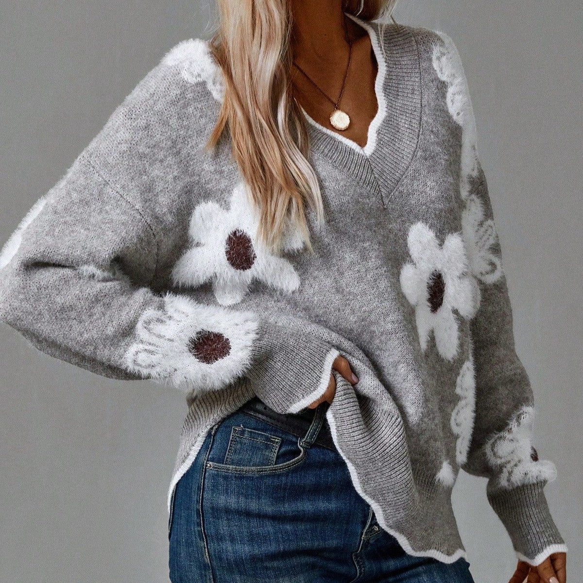 Grey V-neck sweater with floral pattern