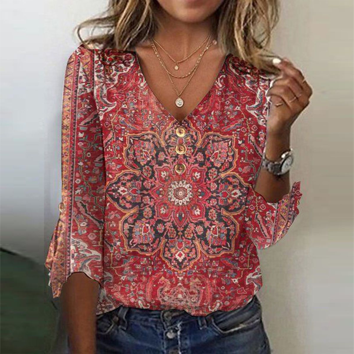 Red top with 3/4-length sleeves and V-neck