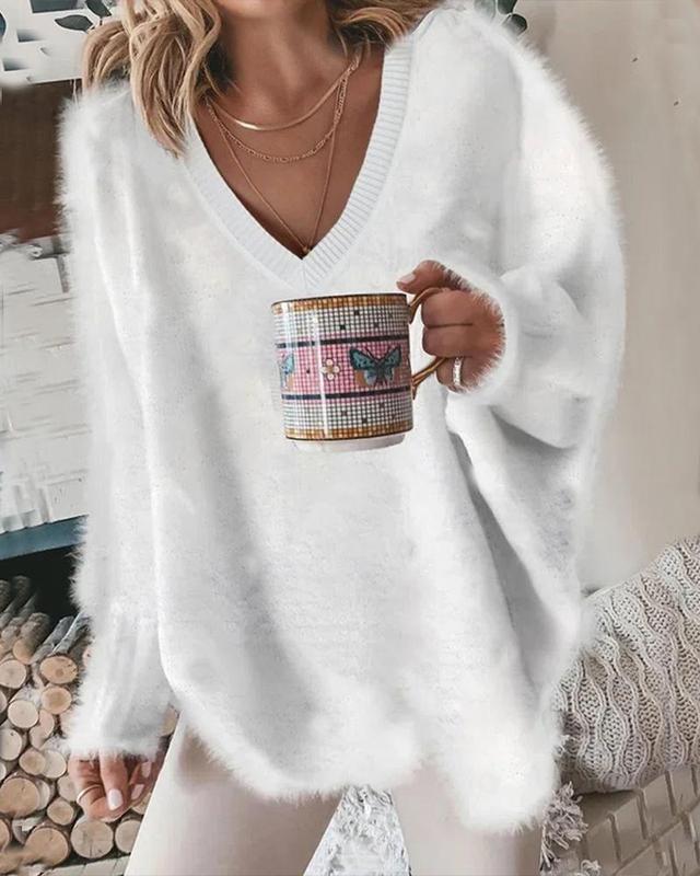 White solid color sweater with V-neck