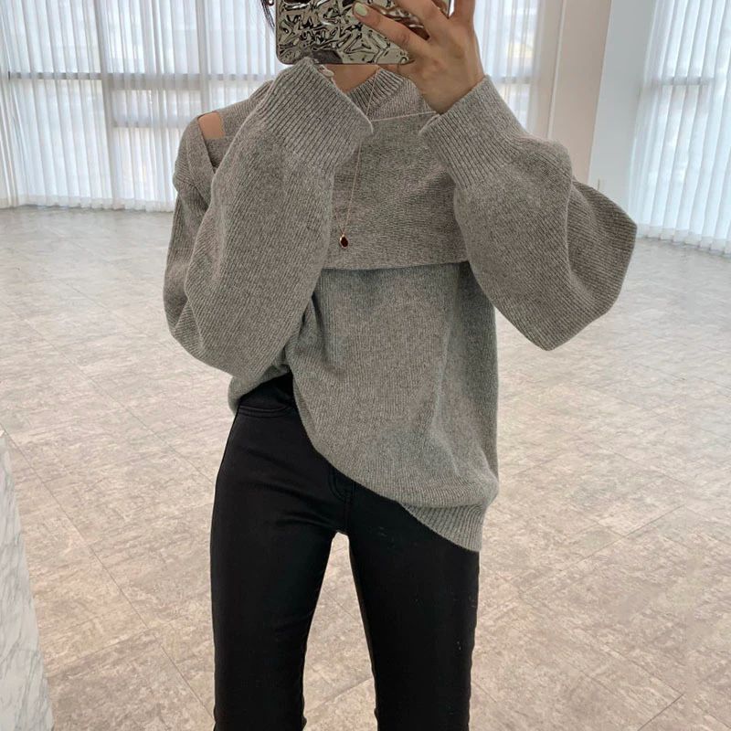 Grey solid color sweater with long sleeves