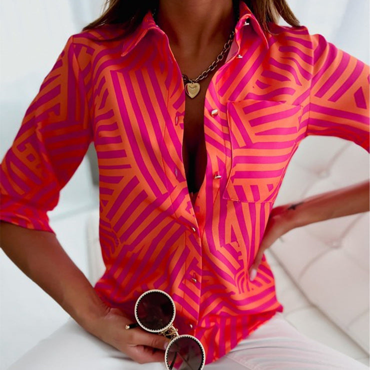 Pink and orange blouse with zig-zag stripes and button placket