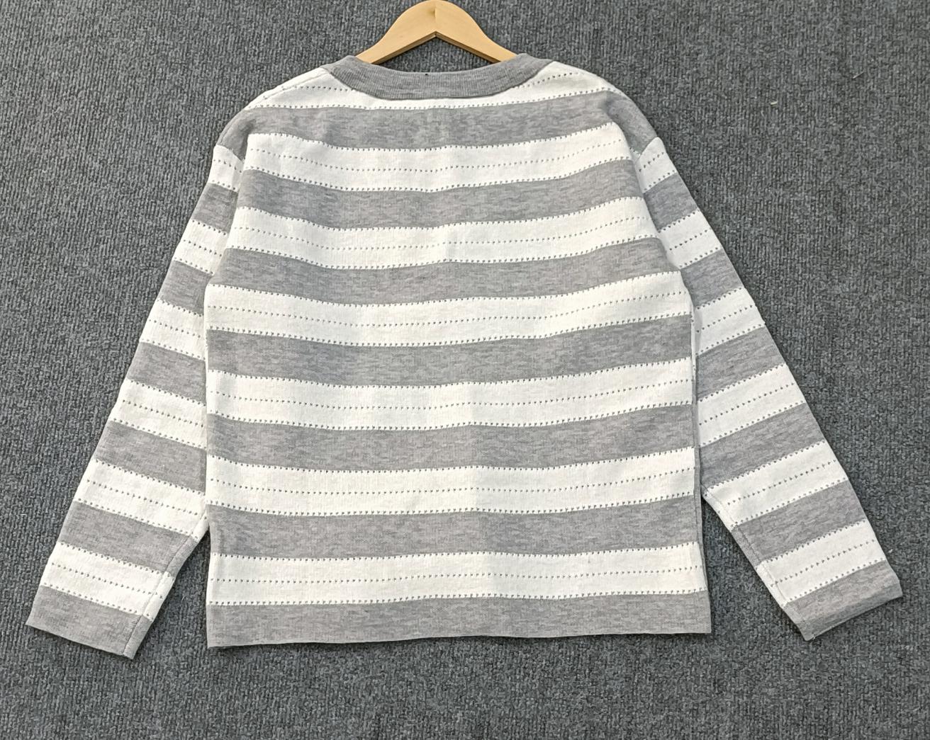 Colliding Stripes sweater with button placket