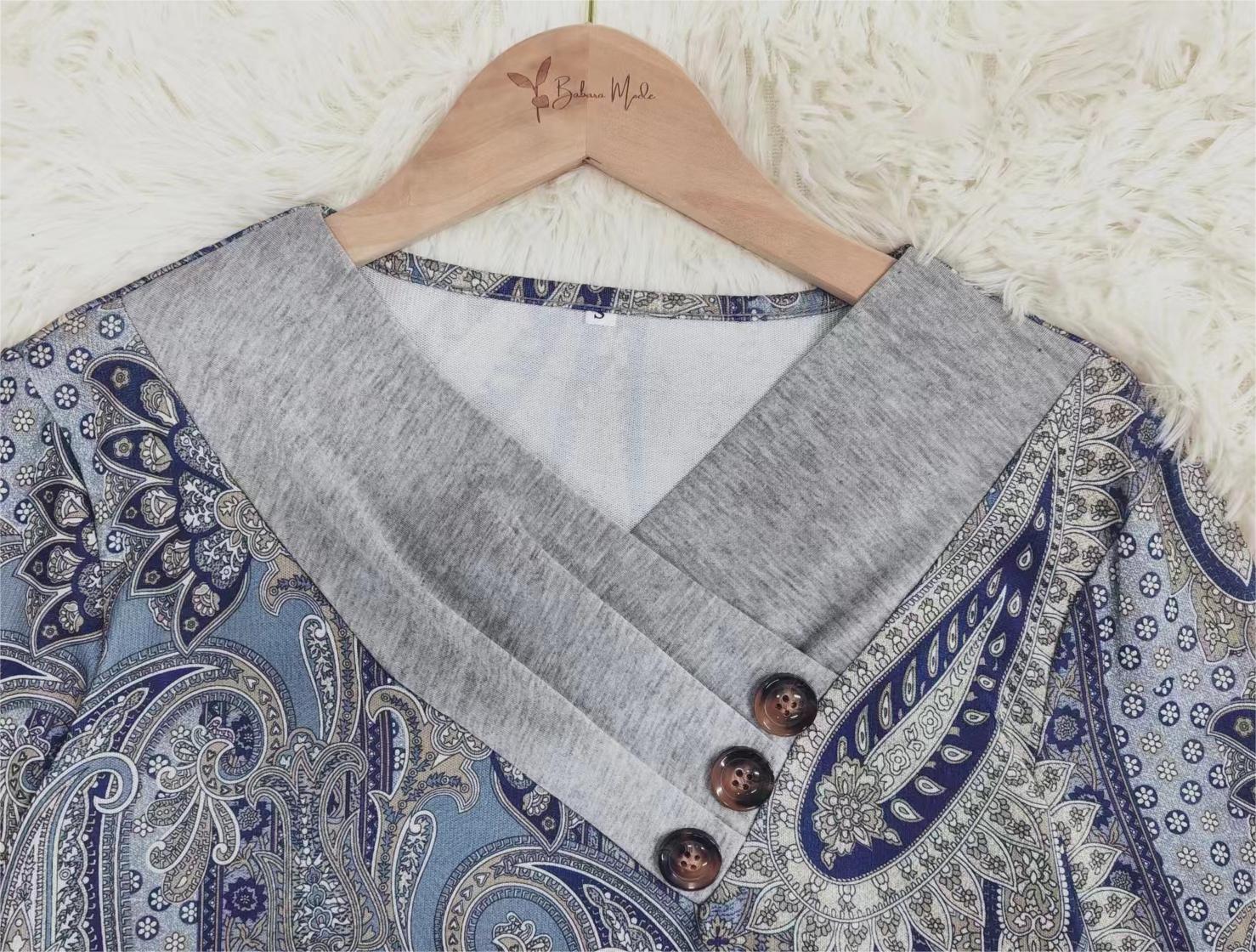 Blue paisley top with grey turn-over collar and long sleeves