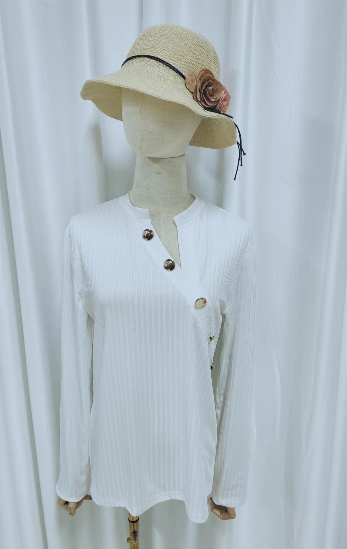 White asymmetrical long sleeve top with button placket