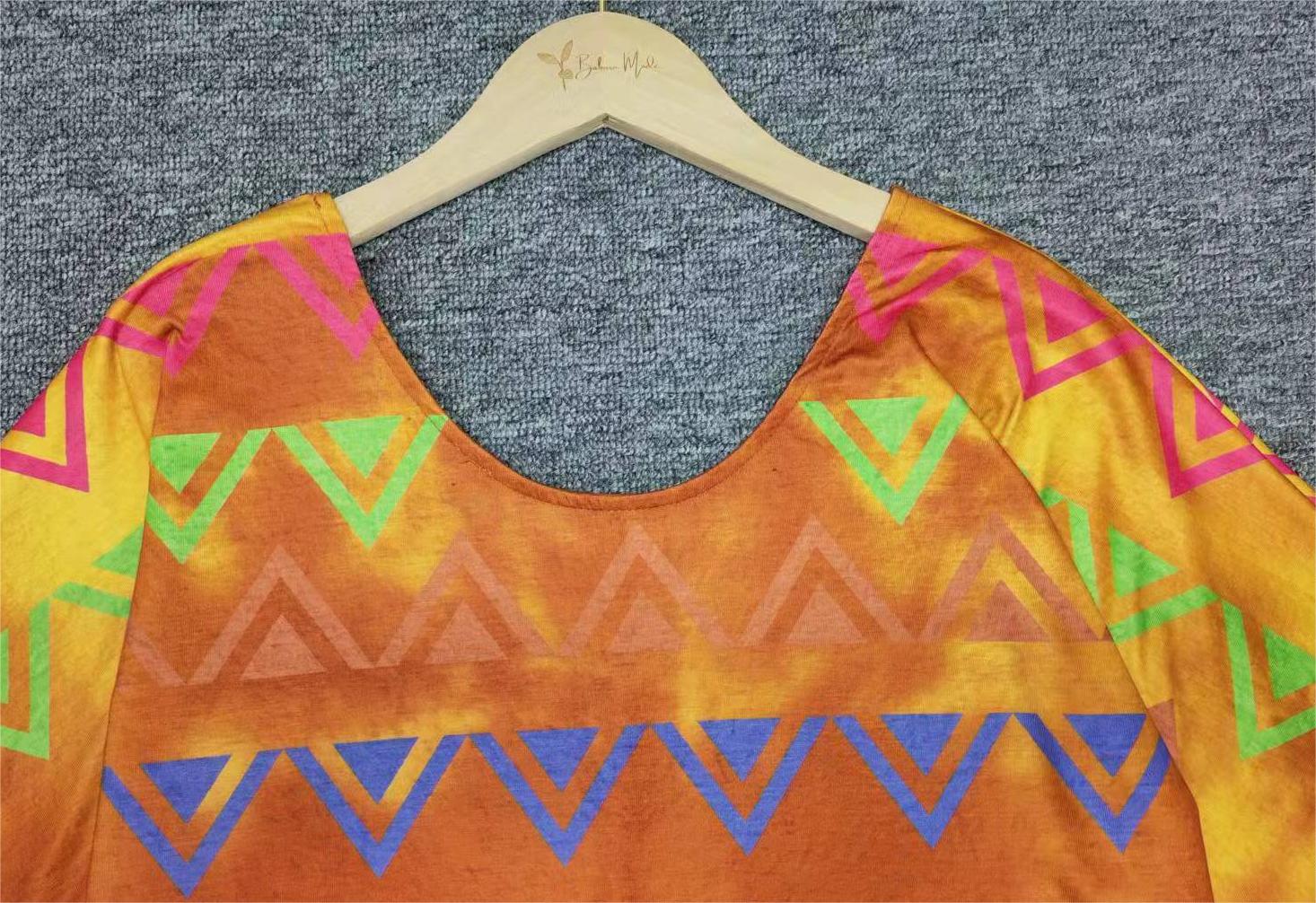 Colorful tunic top with Aztec print and half-length sleeves