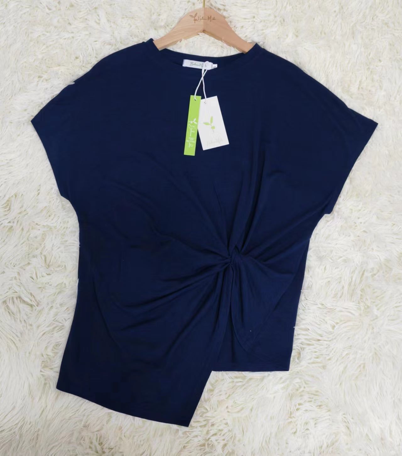 Navy blue shirt with short sleeves and front knots