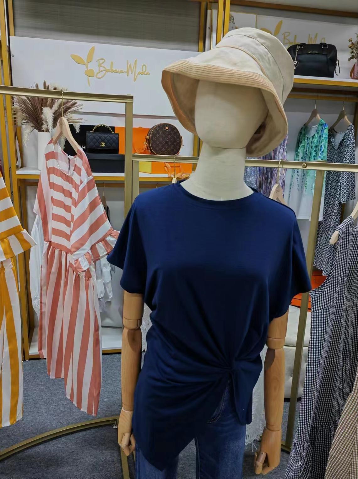 Navy blue shirt with short sleeves and front knots