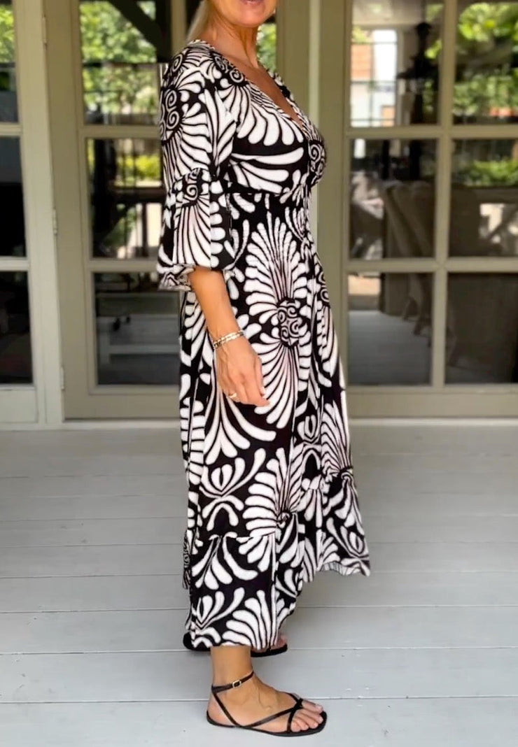 Black and white maxi dress with 3/4-length sleeves