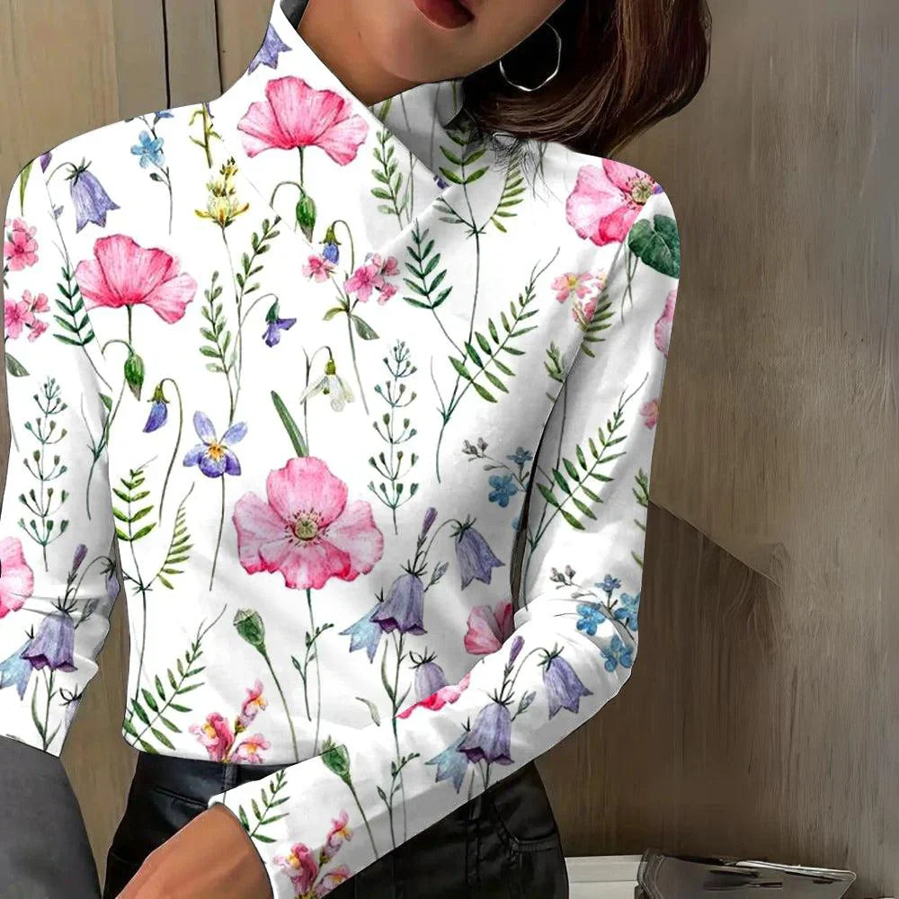 Discover the charm of nature with our FloraChic Silk Blouse, which captivates with its vibrant floral pattern.