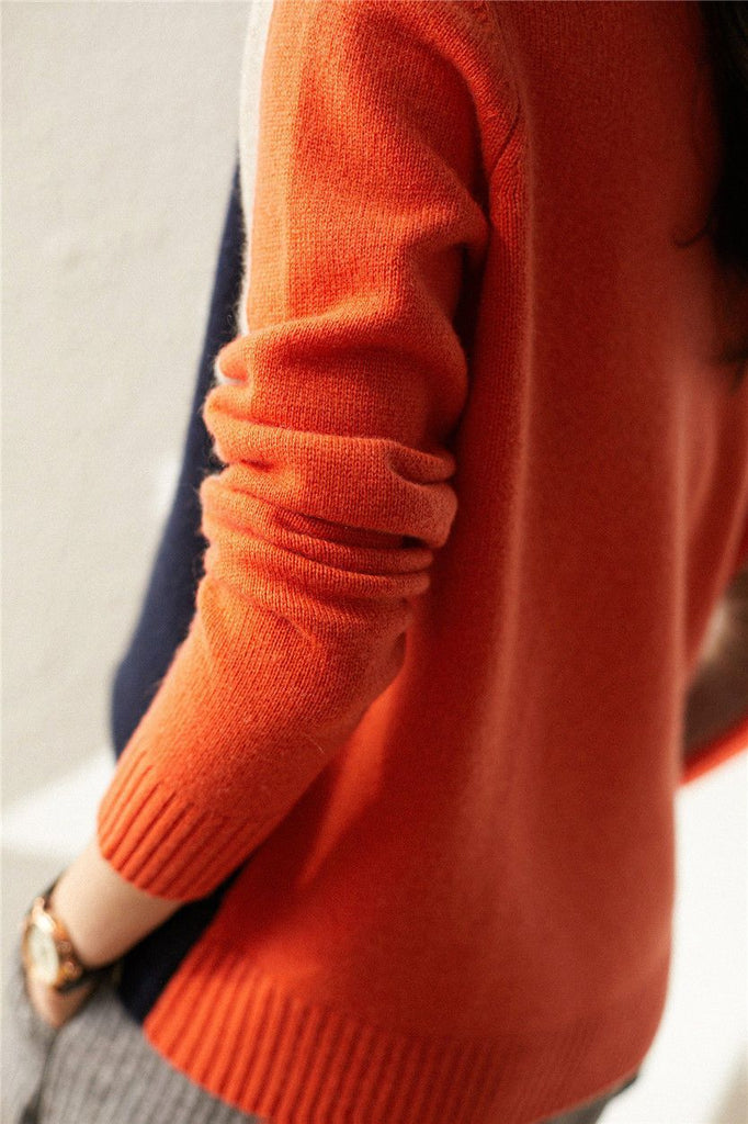 Navy blue and orange sweater with retro stripes