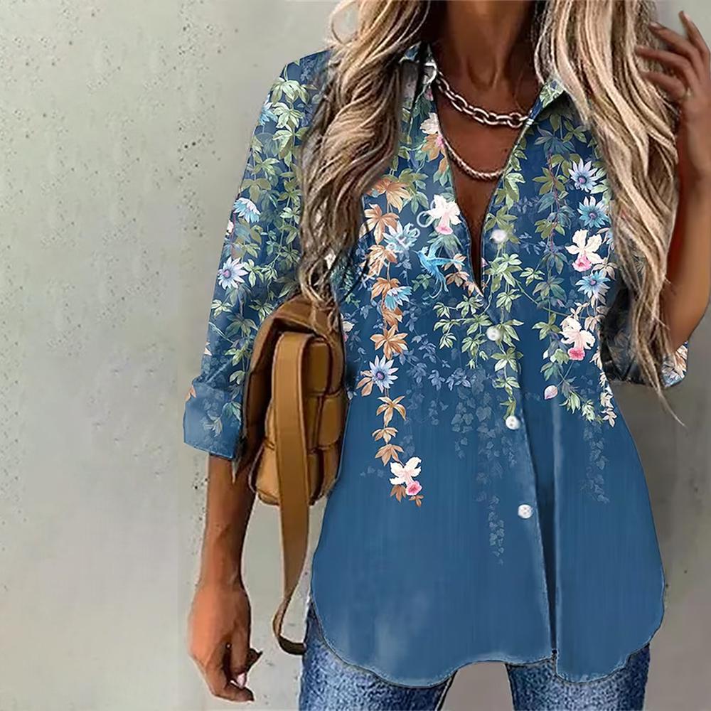 Blue blouse with floral print and leaves