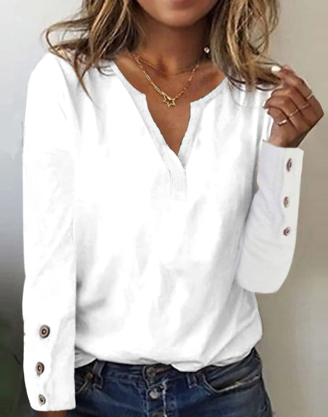 White basic top with long sleeves and button placket