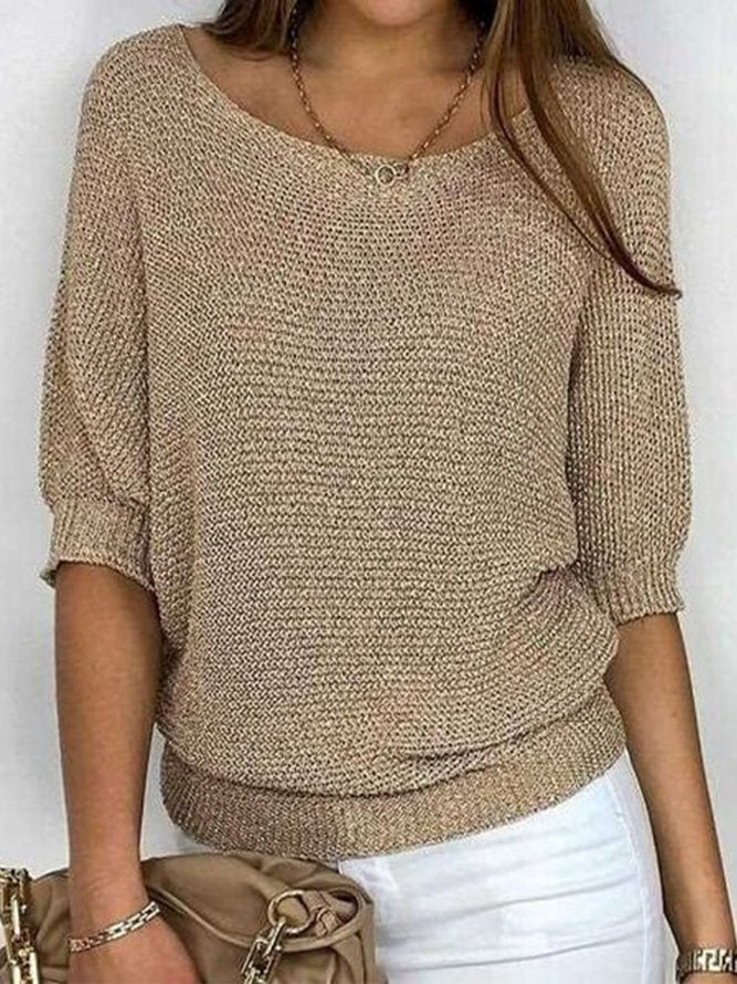 Gold colored solid color sweater with round neckline