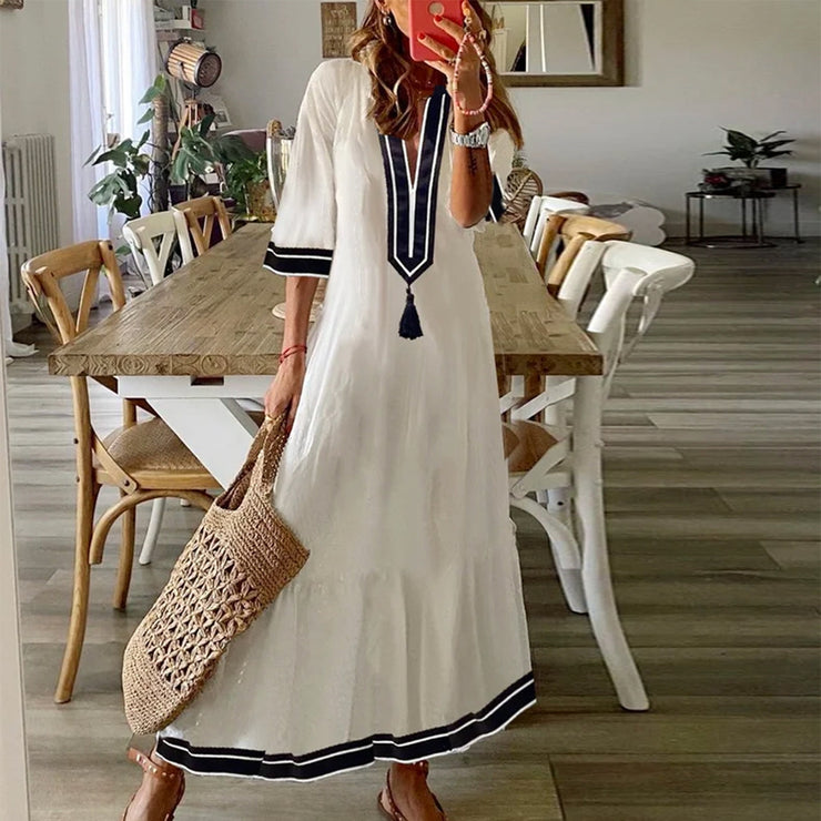 Special white midi dress with V-neck and tassels