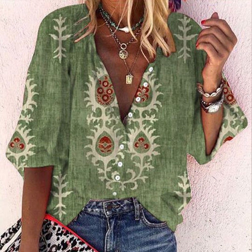 Green top with 3/4-length sleeves and print