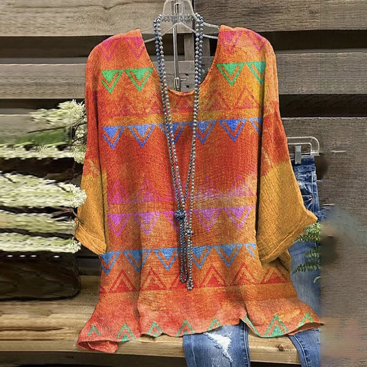 Colorful tunic top with half-length sleeves and aztec print