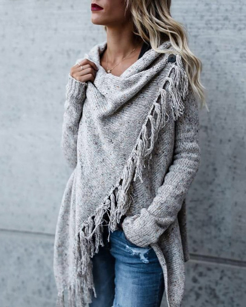 Asymmetrical sweater with long sleeves and tassel slit