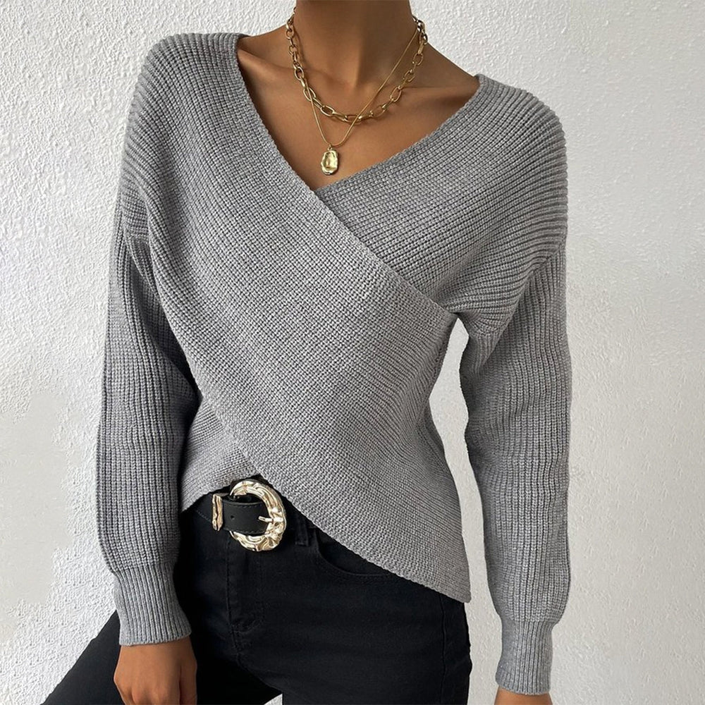 Grey knitted sweater with V-neck and long sleeves