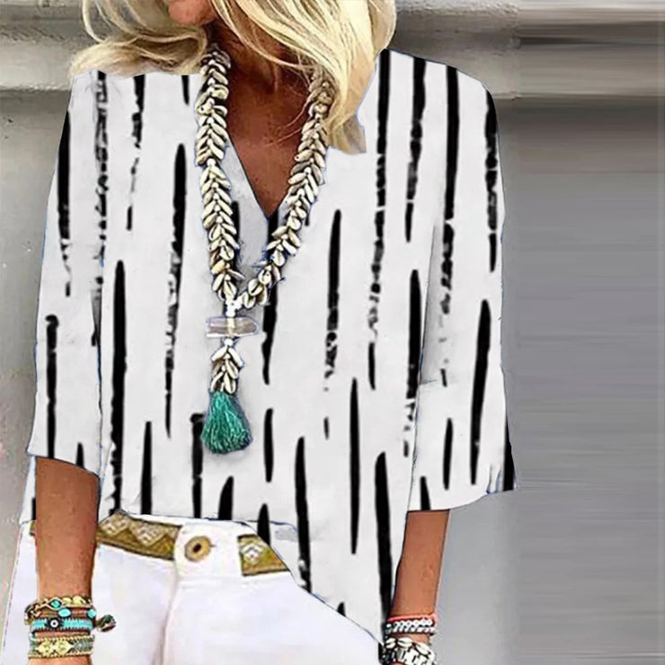 Black and white striped top with 3/4-length sleeves