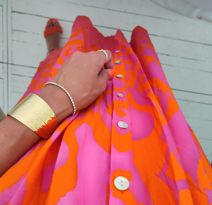 Pink and orange midi dress with ruffled button placket