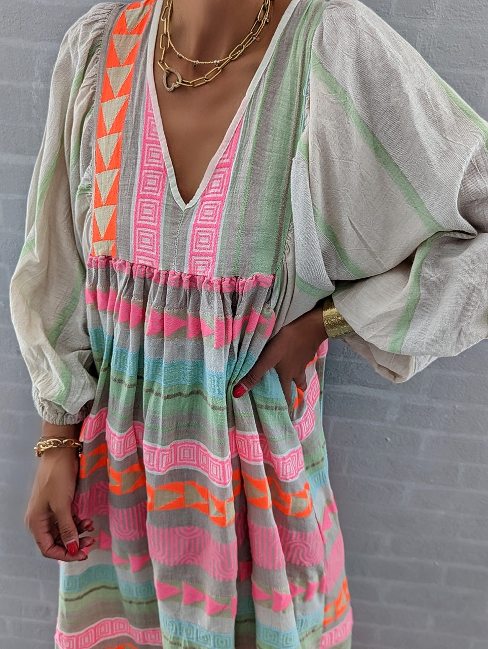 Pink striped midi dress with Greek key and orange chain