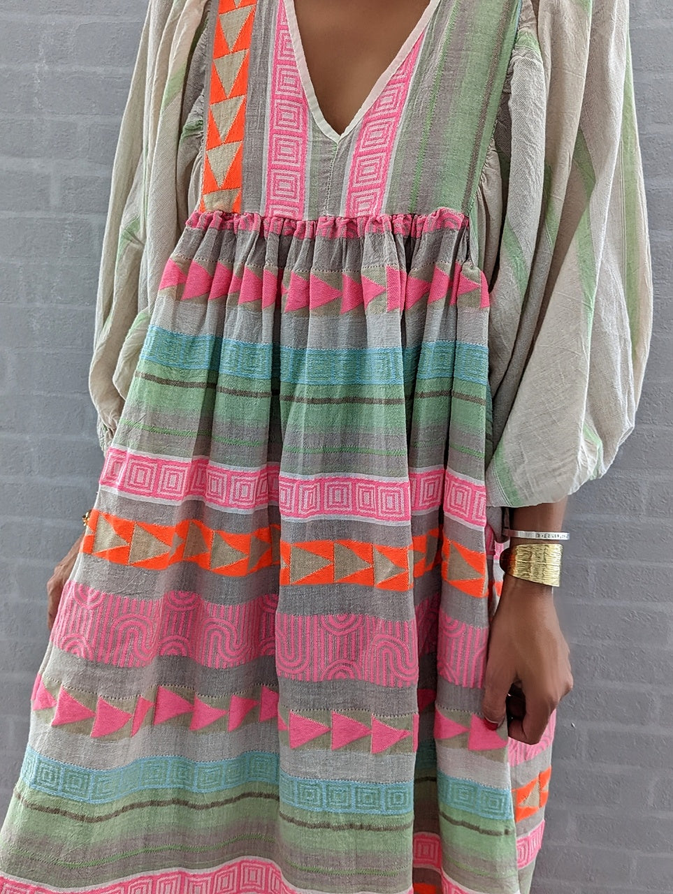 Pink striped midi dress with Greek key and orange chain