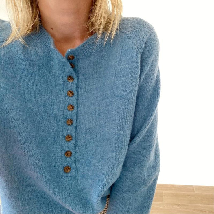 Sky blue sweater with V-neck and button placket