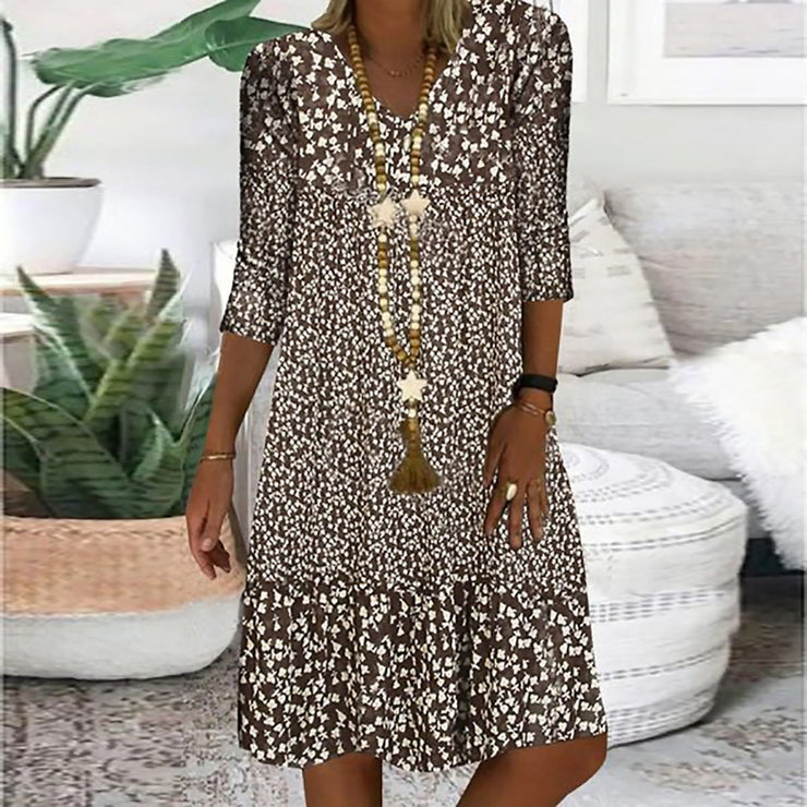 Brown and white prairie mini dress with abstract pattern