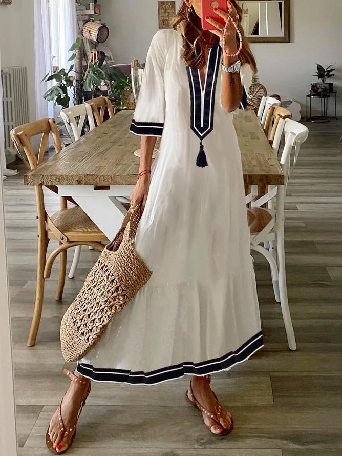 Special white midi dress with V-neck and tassels