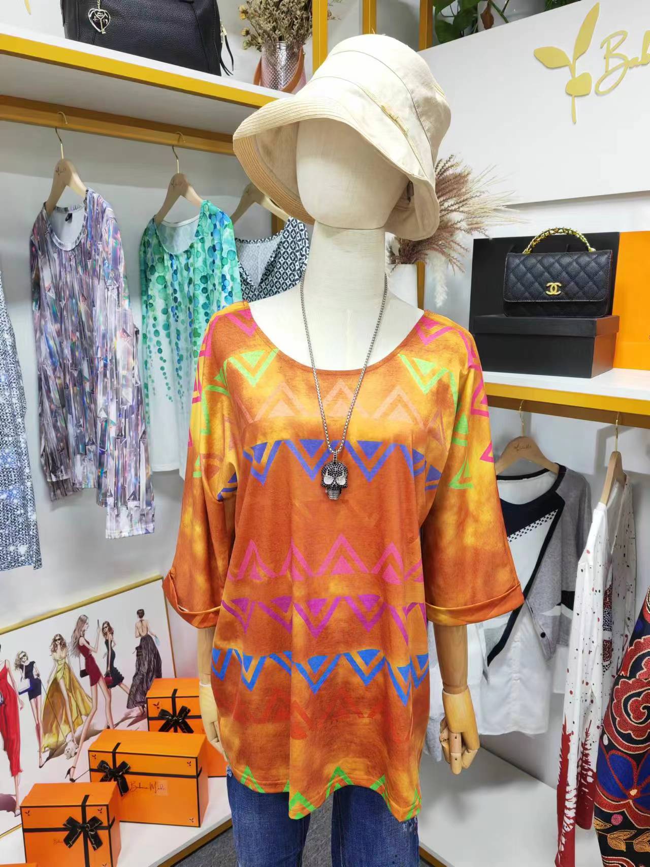 Colorful tunic top with Aztec print and half-length sleeves