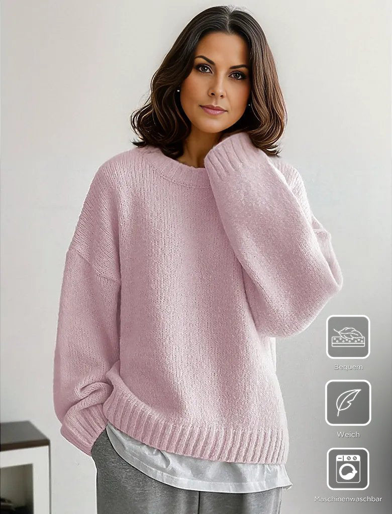 Pink solid color sweater with long sleeves and round neck