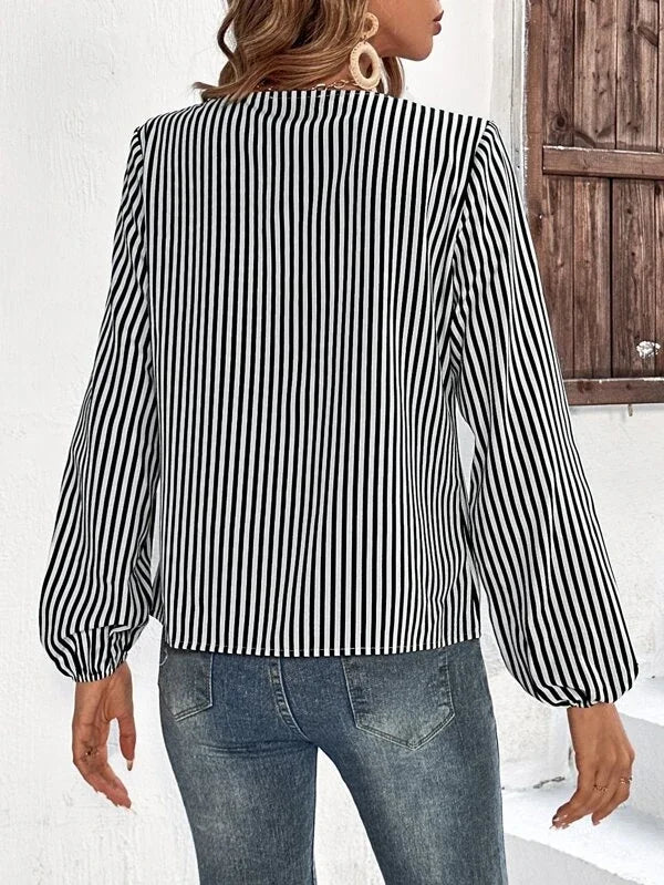 Ruffled black and white striped long sleeve top