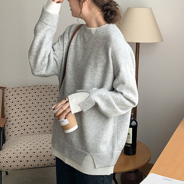 Grey and white oversized sweater with long sleeves and cut-out