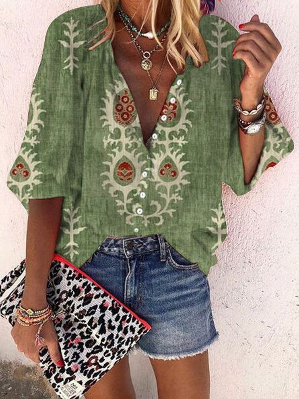 Green top with 3/4-length sleeves and print