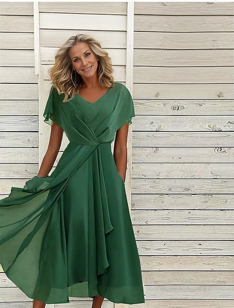 Green midi dress with pleated front slit and jewels