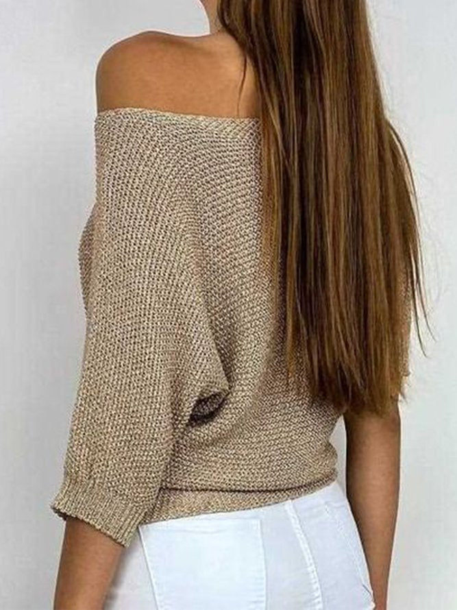 Gold colored solid color sweater with round neckline