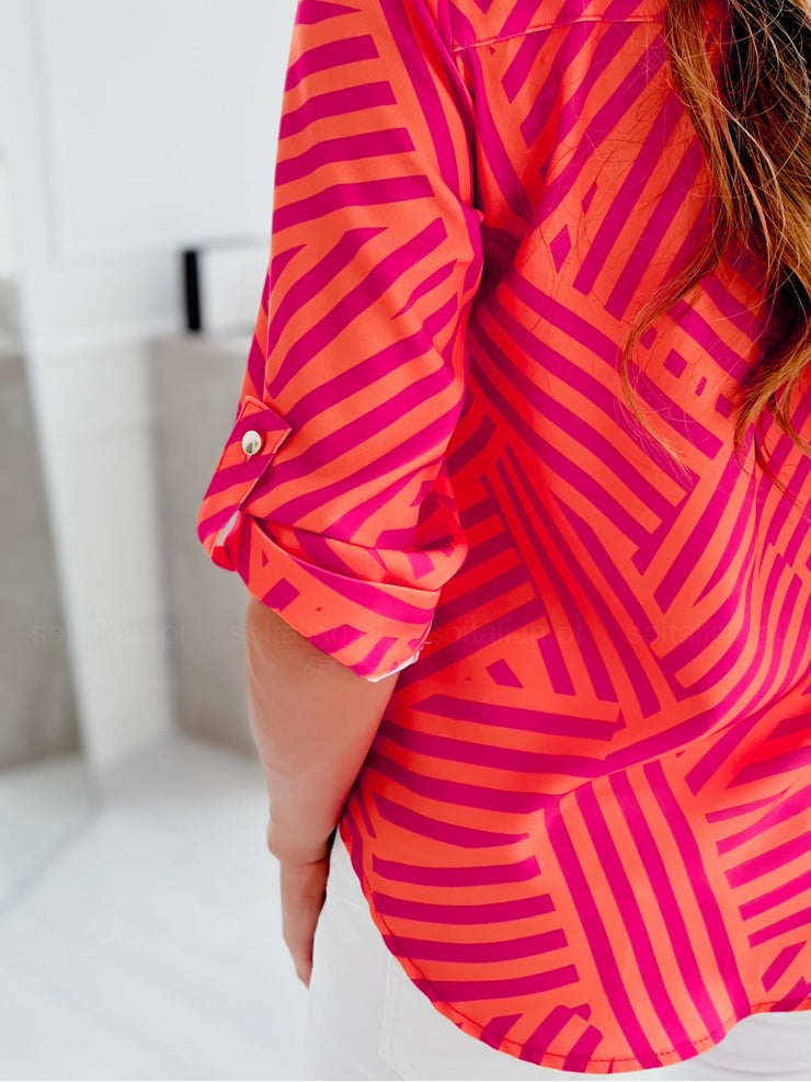 Pink and orange blouse with zig-zag stripes and button placket